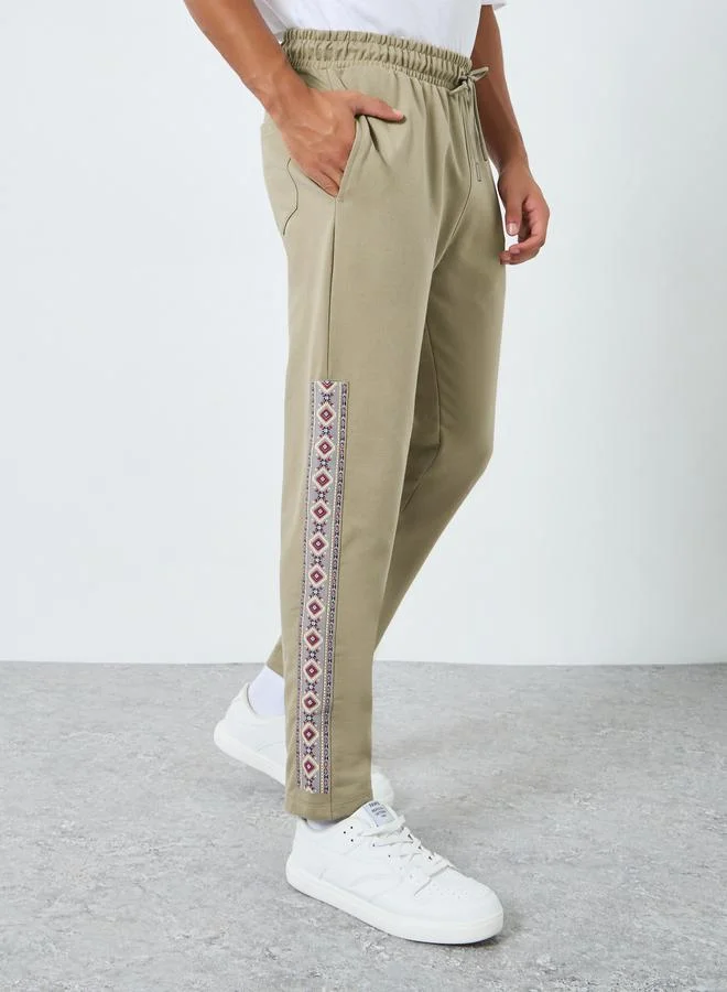 Styli Men Slim Fit Graphic Panel Joggers